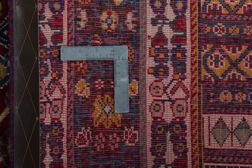 Surface texture of 2000s Shiraz rug with natural Wool and intricate pattern