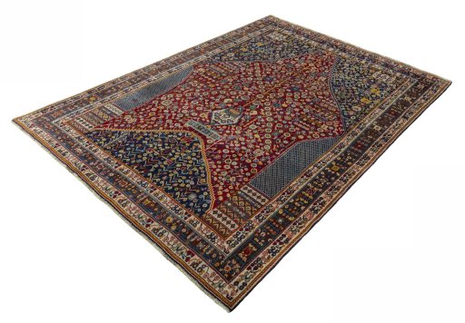 Corner detail of 2000s Shiraz rug showing border pattern and Wool pile