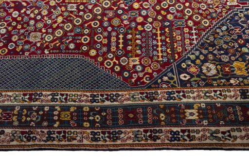 Full view of 2000s Shiraz rug from Iran / Persia, 293 × 210 cm in Red tones