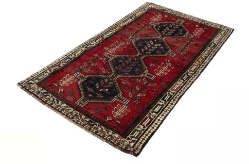 Corner detail of 2000s Shiraz rug showing border pattern and Wool pile