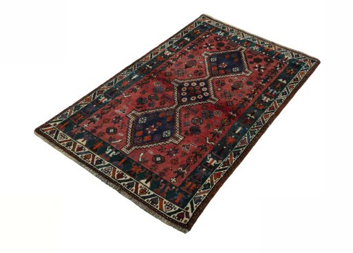 Corner detail of 2000s Shiraz rug showing border pattern and Wool pile