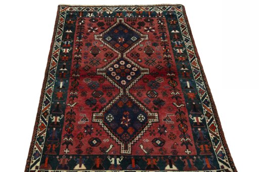 Surface texture of 2000s Shiraz rug with natural Wool and intricate pattern