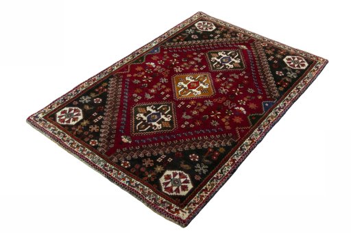 Corner detail of 2000s Shiraz rug showing border pattern and Wool pile