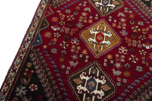 Backside of handmade 2000s Shiraz rug showing knot structure and weave density