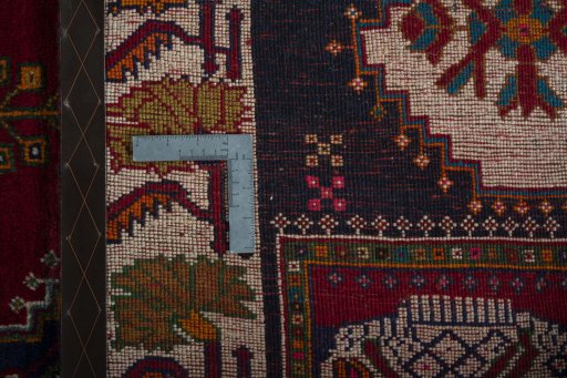 Surface texture of 2000s Shiraz rug with natural Wool and intricate pattern