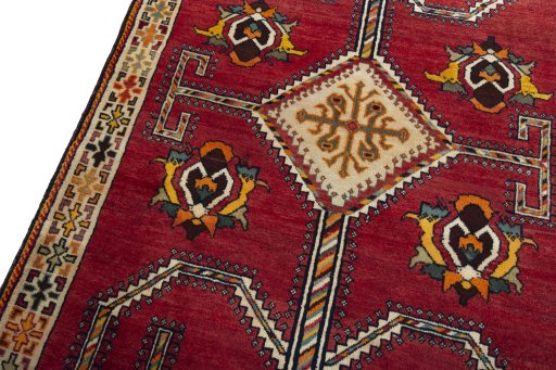 Backside of handmade 2000s Shiraz rug showing knot structure and weave density