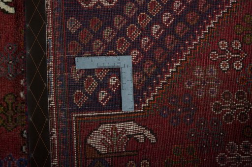 Surface texture of 2000s Shiraz rug with natural Wool and intricate pattern