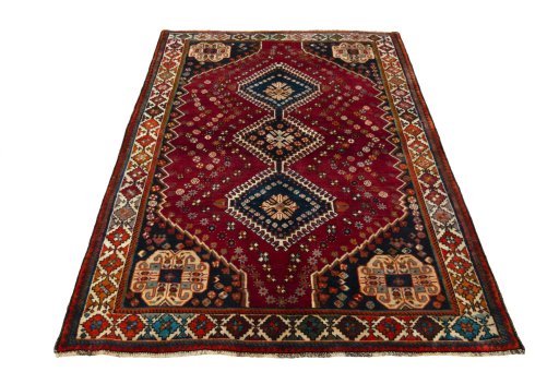 Surface texture of 2000s Shiraz rug with natural Wool and intricate pattern