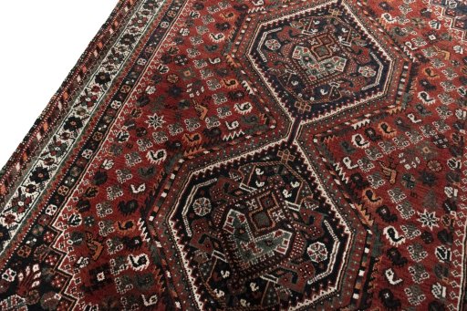 Backside of handmade 2000s Shiraz rug showing knot structure and weave density