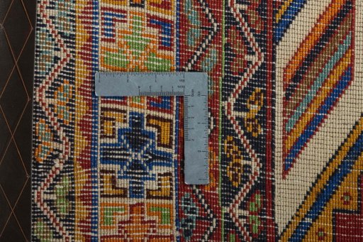 Surface texture of 2000s Shiraz rug with natural Wool and intricate pattern