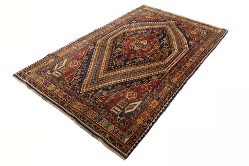 Corner detail of 2000s Shiraz rug showing border pattern and Wool pile