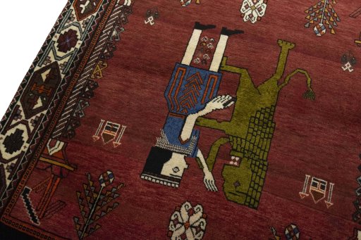 Backside of handmade 2000s Shiraz rug showing knot structure and weave density