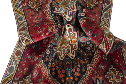 Corner detail of 2000s Shiraz rug showing border pattern and Wool pile