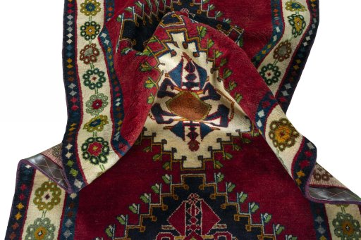 Corner detail of 2000s Shiraz rug showing border pattern and Wool pile