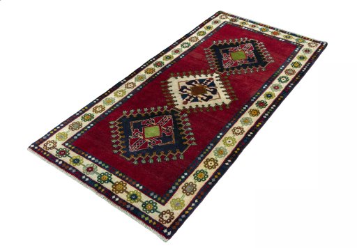 Corner detail of 2000s Shiraz rug showing border pattern and Wool pile