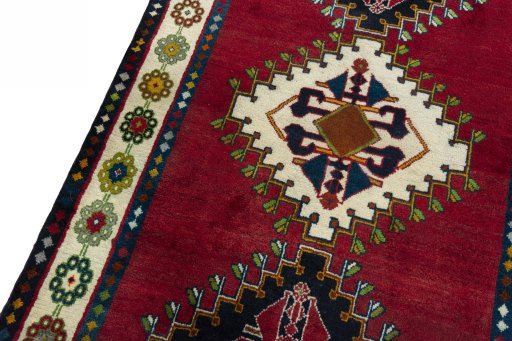 Backside of handmade 2000s Shiraz rug showing knot structure and weave density
