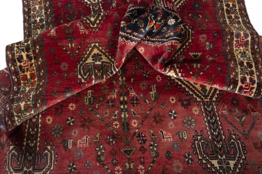 Corner detail of 1970s Shiraz rug showing border pattern and Wool pile