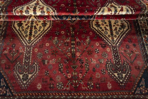 Full view of 1970s Shiraz rug from Iran / Persia, 300 × 155 cm in Red tones