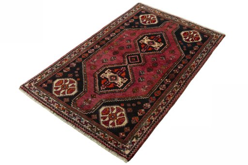 Corner detail of 2000s Shiraz rug showing border pattern and Wool pile