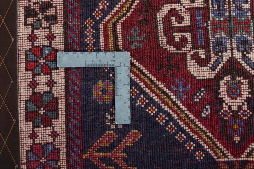 Surface texture of 2000s Shiraz rug with natural Wool and intricate pattern