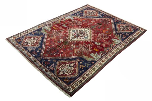 Corner detail of 2000s Shiraz rug showing border pattern and Wool pile