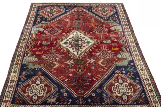 Surface texture of 2000s Shiraz rug with natural Wool and intricate pattern