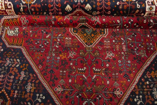 Corner detail of 2000s Shiraz rug showing border pattern and Wool pile