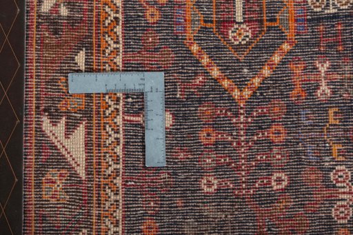 Surface texture of 2000s Shiraz rug with natural Wool and intricate pattern
