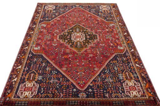 Surface texture of 2000s Shiraz rug with natural Wool and intricate pattern