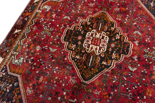 Backside of handmade 2000s Shiraz rug showing knot structure and weave density