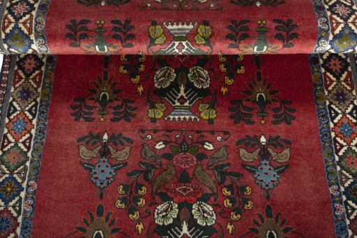 Corner detail of 2000s Shiraz rug showing border pattern and Wool pile