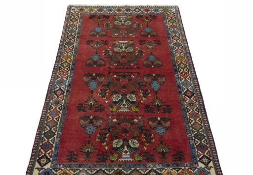 Surface texture of 2000s Shiraz rug with natural Wool and intricate pattern