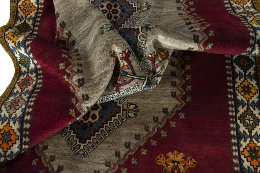 Corner detail of 2000s Shiraz rug showing border pattern and Wool pile