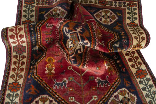 Corner detail of 2000s Shiraz rug showing border pattern and Wool pile