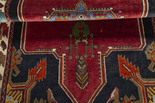 Corner detail of 2000s Shiraz rug showing border pattern and Wool pile