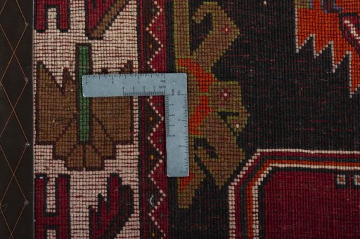 Surface texture of 2000s Shiraz rug with natural Wool and intricate pattern