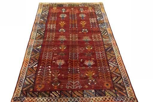 Surface texture of 2000s Shiraz rug with natural Wool and intricate pattern