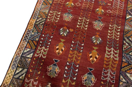 Backside of handmade 2000s Shiraz rug showing knot structure and weave density