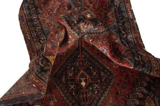 Corner detail of 2000s Shiraz rug showing border pattern and Wool pile