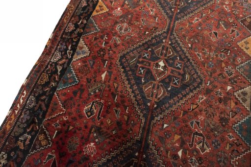 Backside of handmade 2000s Shiraz rug showing knot structure and weave density