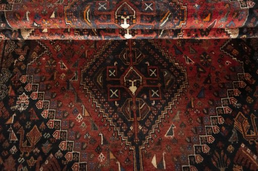 Full view of 2000s Shiraz rug from Iran / Persia, 235 × 144 cm in Red tones