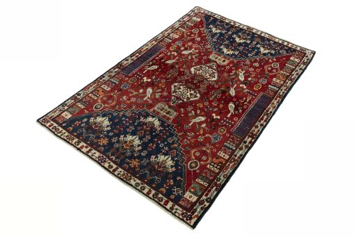 Corner detail of 2000s Shiraz rug showing border pattern and Wool pile