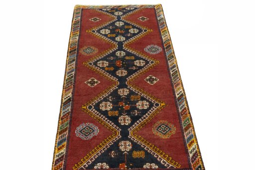 Surface texture of 2000s Shiraz rug with natural Wool and intricate pattern