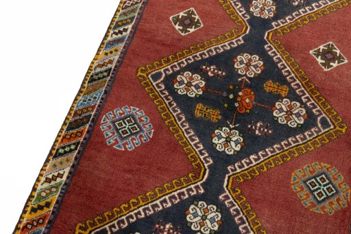 Backside of handmade 2000s Shiraz rug showing knot structure and weave density