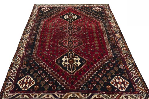 Surface texture of 2000s Shiraz rug with natural Wool and intricate pattern