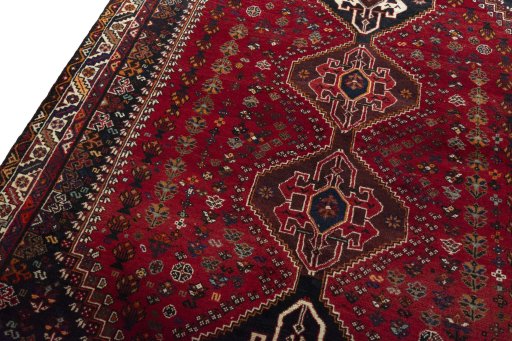 Backside of handmade 2000s Shiraz rug showing knot structure and weave density
