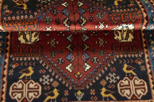 Full view of 2000s Shiraz rug from Iran / Persia, 140 × 103 cm in Red tones