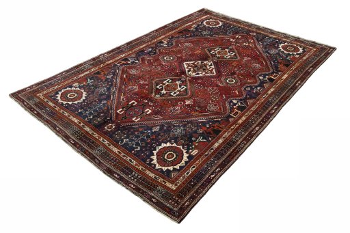 Corner detail of 2000s Shiraz rug showing border pattern and Wool pile