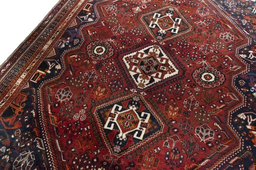 Backside of handmade 2000s Shiraz rug showing knot structure and weave density