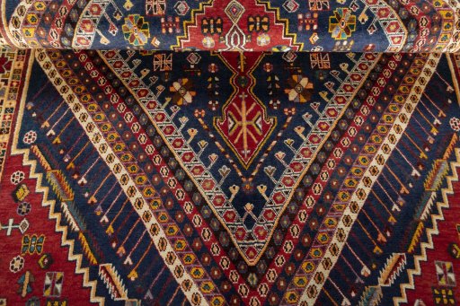 Corner detail of 2000s Shiraz rug showing border pattern and Wool pile